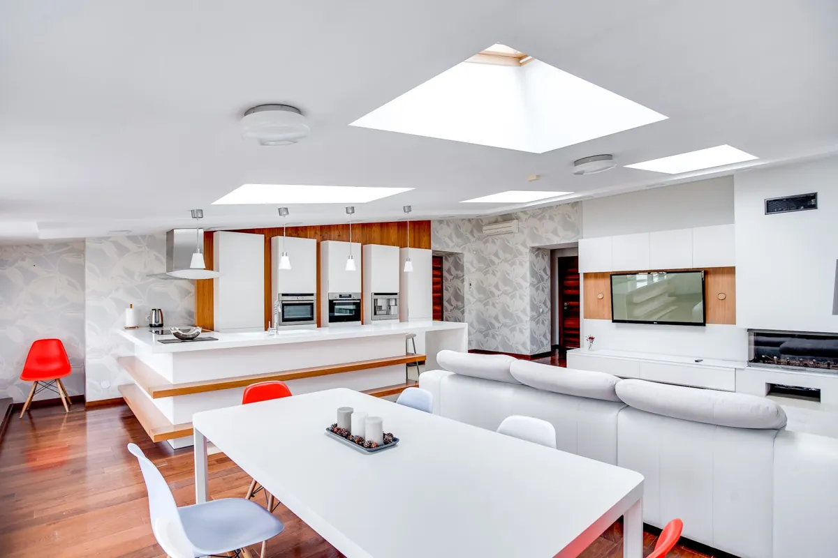 An open-plan home with kitchen, dining and living areas